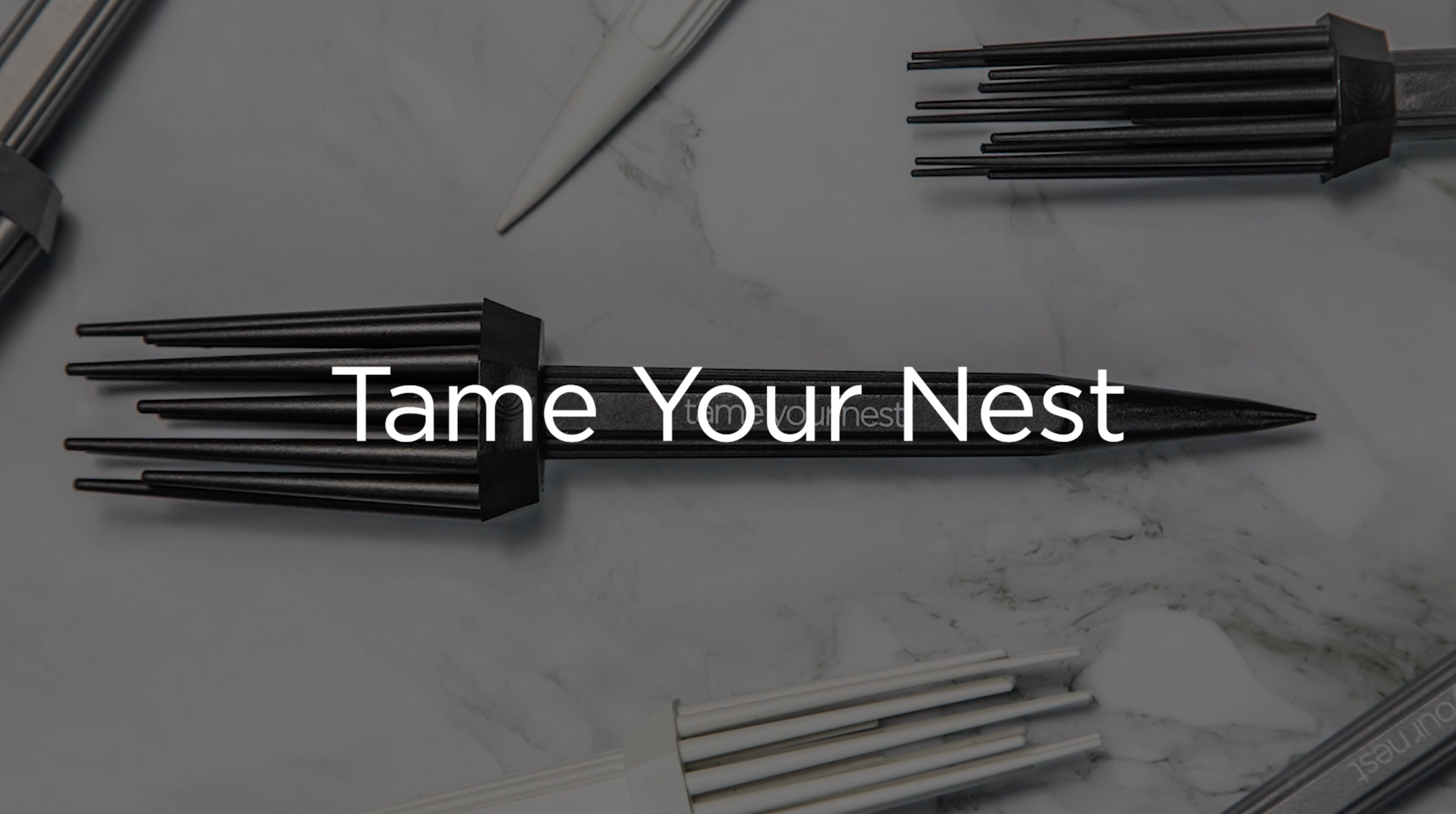 Load video: See why the Tame Your Nest curling tool is the most unique, heat-free curling tool available.